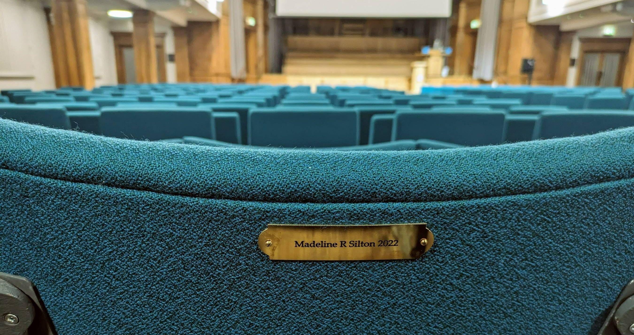 An example of a seat plaque in the Younger Hall